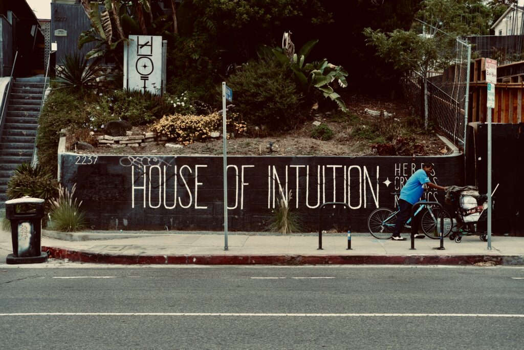 Street mural reading βHouse of Intuition,β symbolising inner wisdom, awareness, and everyday moments of insight.