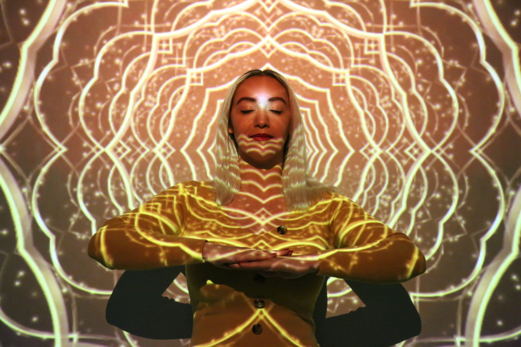 Intuition vs ego represented through a woman in deep meditation, symbolising inner guidance, alignment, and conscious awareness.