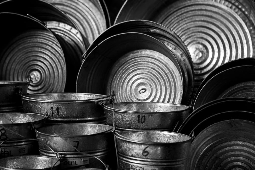 Metal buckets marked with different numbers arranged in rows, symbolizing the numerology life path number system and its number patterns.